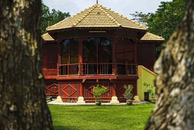 Gazebo in park against building