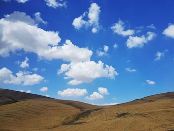 Scenic view of landscape against blue sky