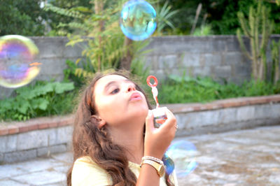 Portrait of woman with bubbles