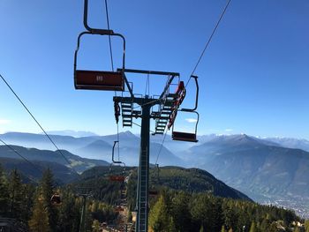 Overhead cable car against mountains during winter