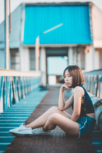 Portrait of woman sitting outdoors