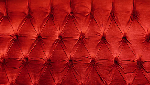 Full frame shot of red velvet sofa