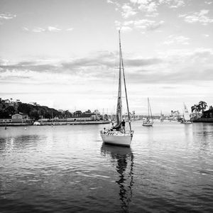 Boats in sea with boats in background