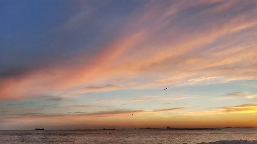 Scenic view of sea against cloudy sky