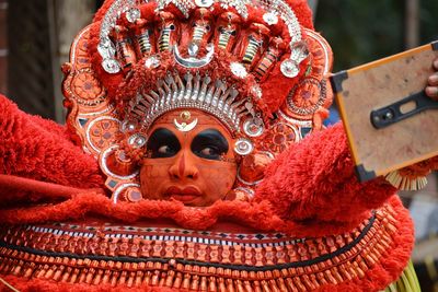Close-up of dancer in traditional clothing during festival