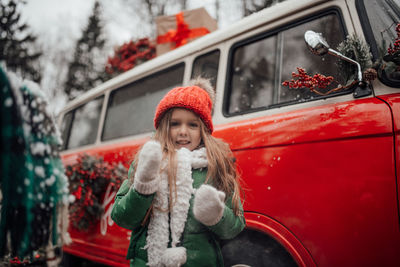 Portrait of young woman in car