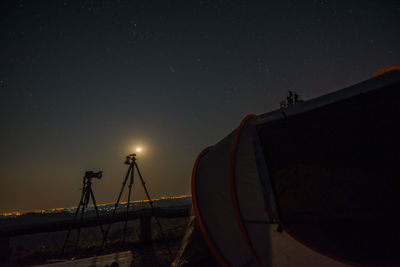 Low angle view of moon against sky at night