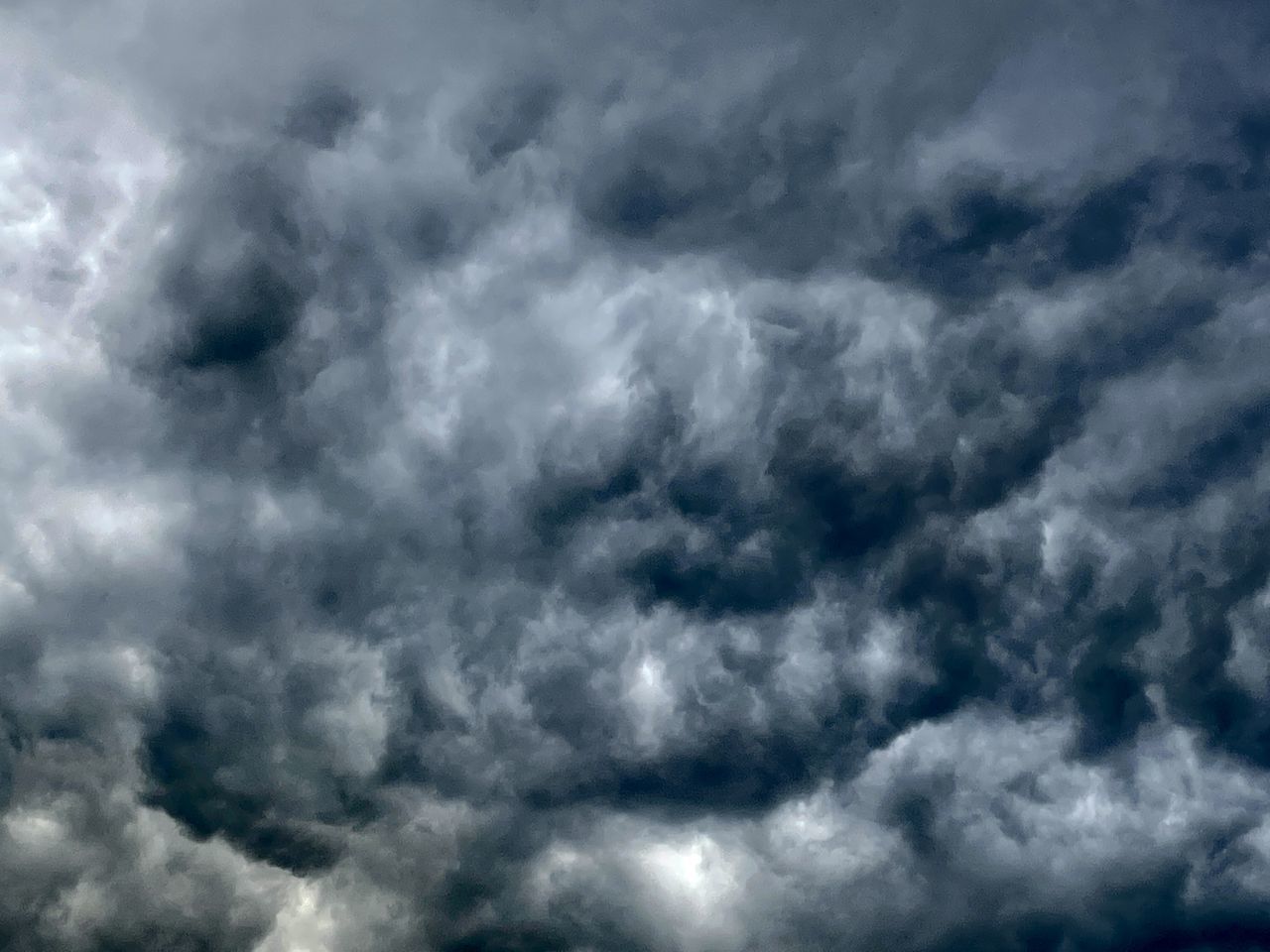 sky, cloud, storm, cloudscape, dramatic sky, storm cloud, overcast, backgrounds, wind, black and white, nature, environment, atmosphere, beauty in nature, thunderstorm, no people, monochrome, daytime, moody sky, dark, meteorology, scenics - nature, climate, ominous, wet, outdoors, blue, curve, rain, gray, fluffy, white, sign, warning sign, cumulonimbus, darkness