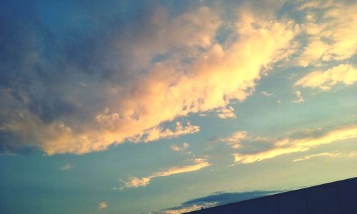 Low angle view of cloudy sky at sunset