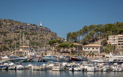 Sailboats moored in marina against sky, port de soller, puerto de soller