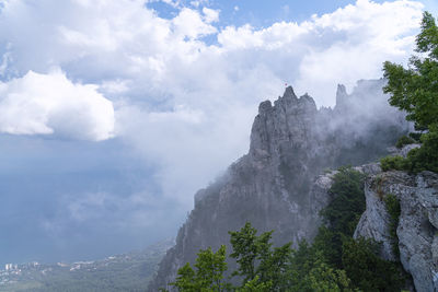 Low angle view of majestic mountains against sky