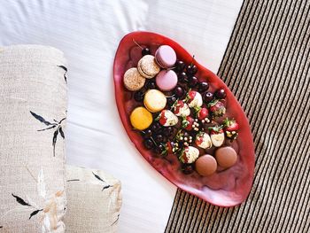 High angle view of candies in plate on table