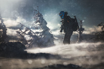 Walking into the blizzard in the carpathian mountains.