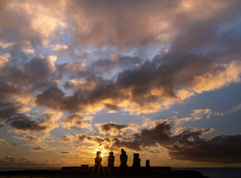 Silhouette people against sky during sunset