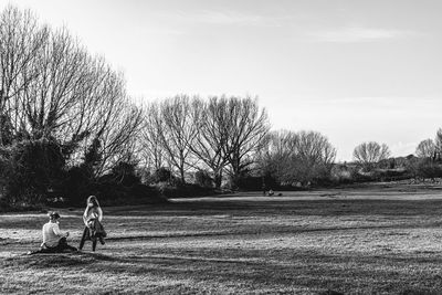 People on field against sky