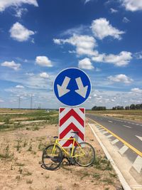 Bicycle sign against sky