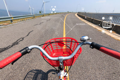 Close-up of bicycle on road against sky