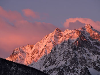 Scenic view of snowcapped mountains against sky during sunset