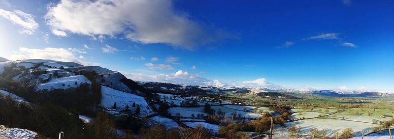 High angle view of snow covered mountain against sky