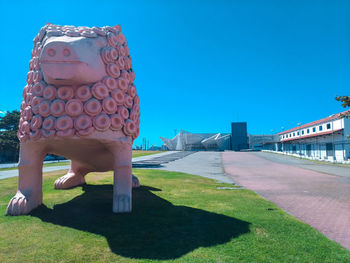 Full length of senior man against clear blue sky