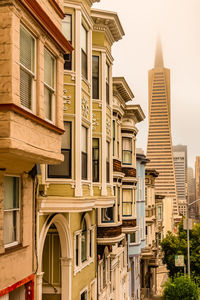 Low angle view of buildings against sky in city