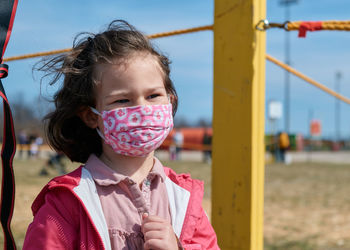 Girl in mask at the county fair