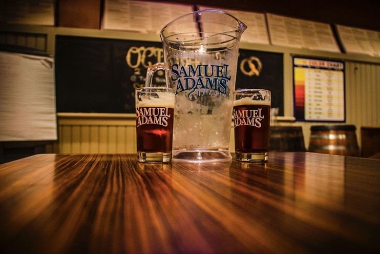 indoors, text, food and drink, western script, drink, glass - material, communication, table, refreshment, transparent, still life, freshness, drinking glass, close-up, no people, jar, restaurant, illuminated, bottle, glass