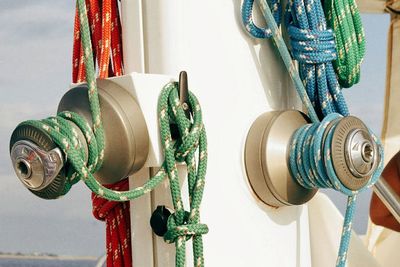 Ropes tied on mast of boat