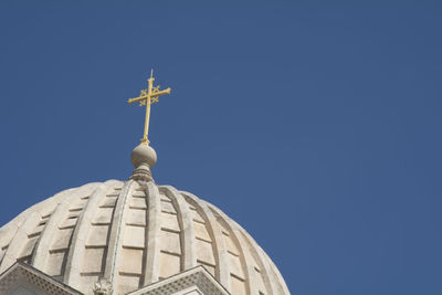 Low angle view of a building against blue sky