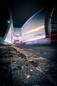 Blurred motion of illuminated street and buildings at night