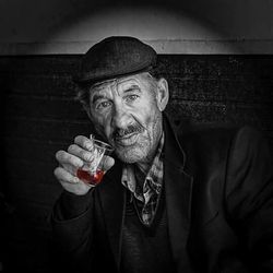 Portrait of man drinking glasses