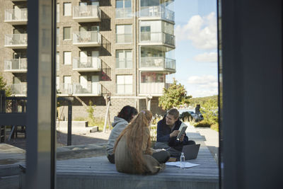 Friends sitting outside together