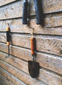 Close-up of gardening equipments on the wall