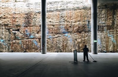 Sweeper cleaning the floor against architectural columns