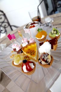 High angle view of various dessert served on table