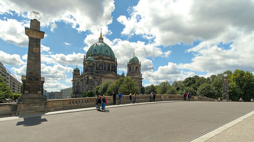 View on berliner dom with cloudy sky and people