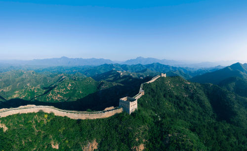 View of the great wall and mountains under the blue sky