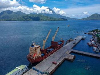 High angle view of harbor by sea against sky