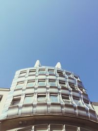 Low angle view of building against clear blue sky