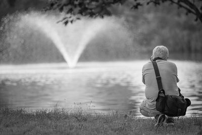 Rear view of woman looking at lake