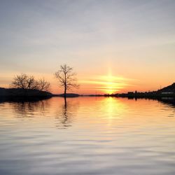 Scenic view of lake against sky during sunset