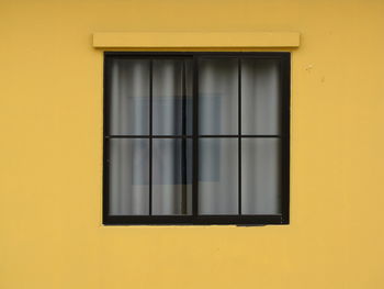 Full frame shot of yellow window of building