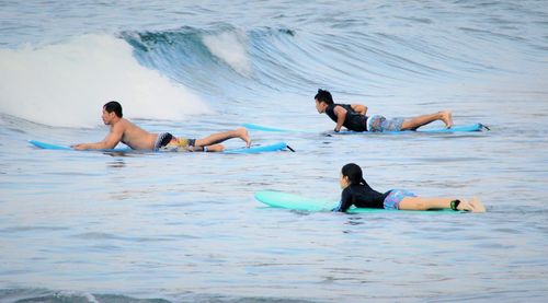 Friends enjoying in swimming pool