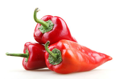 Close-up of bell peppers against white background