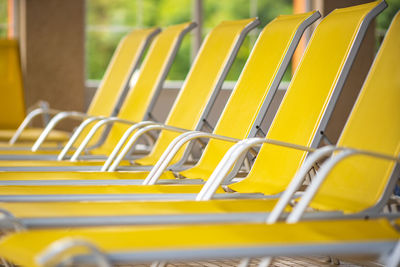Close-up of yellow chairs
