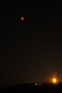 Scenic view of moon against clear sky at night