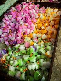High angle view of multi colored candies in container