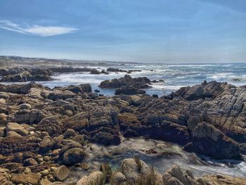 Asilomar rocky coastline, pacific grove, daytime, blue skies, hiking path, beach