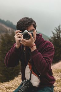 Man photographing with camera