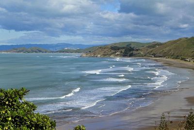 Scenic view of sea against cloudy sky